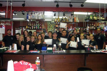 Lear behind an actual bar the Premium Institute of Bartending in Dallas, Texas!