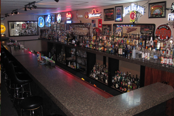 Learn behind an actual bar the Lexington Bartending School.