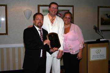 David and Quinn Edwards receiving the "2005 School of the Year" Award from PBSA president, Roger Oldham in Key West, Florida.