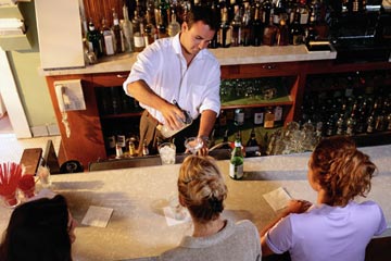 Lear behind an actual bar the St. Louis Bartending Institute