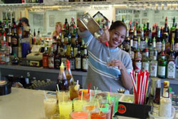 Actual students practicing behind the bar at the Maryland Bartending Academy!