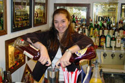 Actual students practicing behind the bar at the Maryland Bartending Academy!