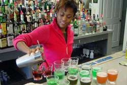 Actual students practicing behind the bar at the Maryland Bartending Academy!